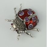 A white metal enamel ladybird brooch 3cm