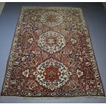 A Boldaji pink, white and blue ground Persian carpet with 3 medallions to the centre 306cm x 210cm