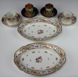 A pair of 19th Century Austrian cabinet cups and saucers with blue and gilt grounds decorated with