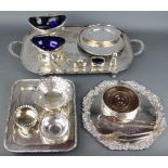 A silver plated 2 handled tray 59cm, two plated swing handled baskets with blue glass liners and