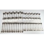 Twelve silver plated lily pattern dinner forks, 12 dessert forks, 11 dessert spoons and 12 teaspoons