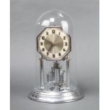 An Art Deco 400 day clock with octagonal dial, Arabic numerals, contained in a chrome case