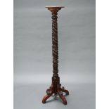 A William IV carved and turned mahogany bedpost torchere, raised on a tripod base 155cm h x 29cm