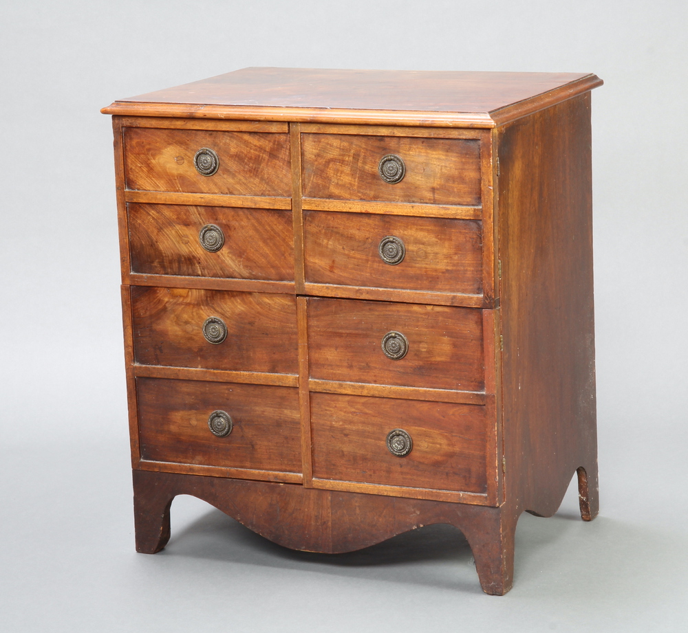 A 19th Century mahogany commode in the form of a 4 drawer chest enclosed by panelled doors 70cm h