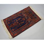 A blue and tan ground Persian prayer rug with tree of life decoration 135cm x 82cm