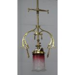 An Edwardian brass hanging gas light fitting with etched glass shade marked Nico no.21, converted to