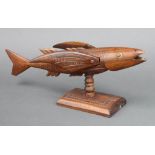 Fred M Christian, a Pitcairn carved hardwood figure of a fish, the fins marked Souvenir from