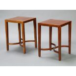 A pair of Georgian style square mahogany lamp tables, raised on tapered supports with C shaped