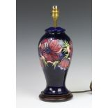 Moorcroft, a modern table lamp decorated anemone pattern with blue ground 29cm