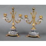 A pair of Victorian grey marble and painted gilt metal twin light candelabrum, raised on socle bases