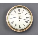 A ward room style clock with 24cm silvered dial and Roman numerals contained in a brass and light