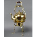 A large and impressive Art Nouveau brass tea kettle and stand, raised on cabriole supports 56cm h