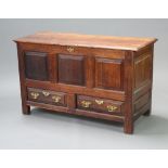 An 18th Century oak mule chest of panelled construction, the base fitted 2 long drawers 76cm h x