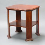 A 1920's Art Deco octagonal 2 tier mahogany occasional table raised on club supports 68cm h x 67cm w