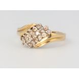 An 18ct yellow gold crossover diamond ring, size M 1/2, 4.3 grams