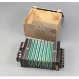 The Gem Melodeon accordion, contained in a pine box