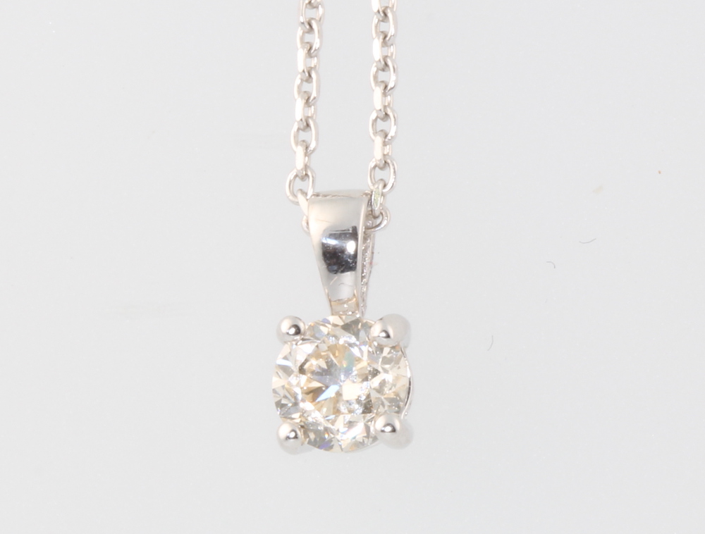 An 18ct white gold single stone diamond pendant 0.7ct on an 18ct white gold chain 38cm, 3.3 grams