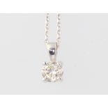 An 18ct white gold single stone diamond pendant 0.7ct on an 18ct white gold chain 38cm, 3.3 grams