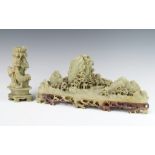 A soapstone carving of an extensive mountainous landscape with buildings and trees 36cm together