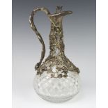 A Victorian cut glass silver plated mounted ewer with vinous decoration and rustic handle, 27cm