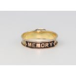 A 19th Century yellow metal in memoriam ring 1.2 grams, size M The enamel and hair decoration is