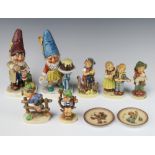 Two Hummel figures of gnomes Well 317, 19cm (chipped) a ditto Well 506, 19cm (chipped) five