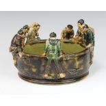 A Chinese slip glazed bowl in the form of 6 figures and a monkey looking over the rim 17cm