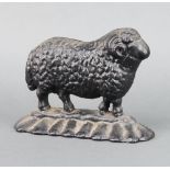 A Victorian black painted cast iron door stop in the form of a standing ram 16cm x 20cm x 5cm