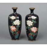 A handsome pair of hexagonal black ground and floral patterned cloisonne vases 14cm h x 3cm diam.