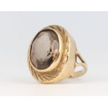 A 9ct yellow gold oval smoky quartz ring 5.9 grams, size L