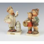 A Hummel figure "Little Pharmacist" no 322, 14cm, together with a Hummel figure of a boy and girl