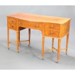 An Edwardian satinwood bow front dressing chest /sideboard with quarter veneered top, fitted 1
