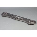 A Victorian pierced cast iron fire curb of serpentine outline 18cm x 117cm w x 35cm d