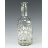 A moulded clear class Jack Daniels Gold Medal Old No.7 spirit bottle 32cm