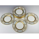 Twelve Minton dinner plates with gilt rims and blue panels of flowers 27cm