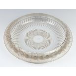 A Lalique Marguerites frosted and clear glass shallow bowl having a moulded floral rim with engraved