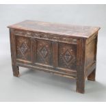A 17th/18th Century carved oak coffer with hinged lid, the interior fitted a candle box, 79cm h x