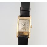 A gentleman's 9ct yellow gold Art Deco Tonneau shaped wristwatch 38mm x 22mm on a leather strap (the