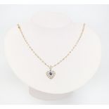 An 18ct yellow gold necklace 46cm together with a yellow metal heart shaped pendant, 12.3 grams