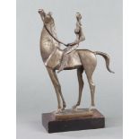 In the manner of Elizabeth Frink, a bronze figure of a lady on horseback, raised on a wooden base