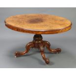 A Victorian oval figured walnut and quarter veneered Loo table, raised on a carved column and tripod