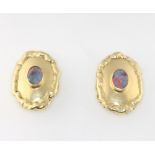 A pair of 18ct yellow gold oval opal ear clips (for pierced ears) 11.4 grams, 24mm