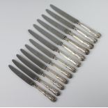 A set of 6 Kings Pattern silver handled dessert knives and 6 silver handled dinner knives, Sheffield