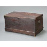 A 19th Century elm coffer with hinged lid and iron drop handles, raised on a platform base 46cm h