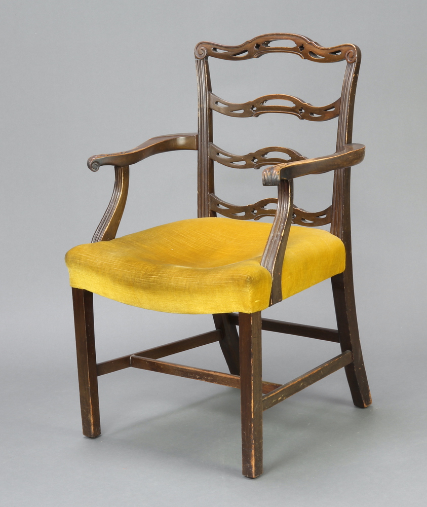 A mahogany London ladder back carver chair with overstuffed seat in yellow material, on square