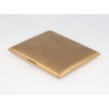 A 9ct yellow gold engine turned cigarette case, gross weight 69.5 grams