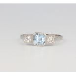 A platinum aquamarine and diamond 3 stone ring, the centre stone approx. 1.7ct, the brilliant cut