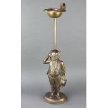 A metal door stop in the form of a standing Mr Pickwick converted to a smokers pedestal ashtray 67cm