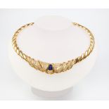 A yellow metal (stamped 750) diamond and sapphire twist necklace containing 238 brilliant cut
