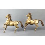 A pair of gilt bronze figures of prancing horses 39cm h x 47cm w x 8cm d
